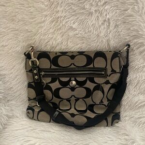 Gray crossbody Coach bag with black Cs